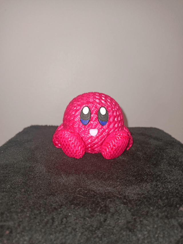 Figurine tricoté rose nacré 