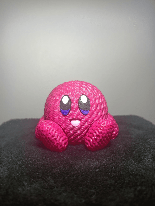 Figurine tricoté rose nacré 